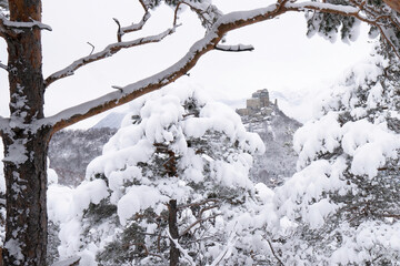 Image of the Ancient/ Abbey of San Michele built on Mount Pirchiriano located at the entrance of the Susa Valley, around the years between 983 and 987 A.D. with an abundant snowfall