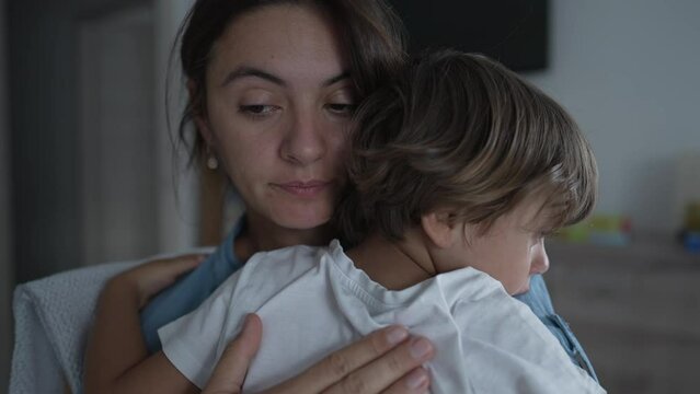 Mother caressing crying child back. Mom consoling son. Lifestyle Motherhood love and care concept