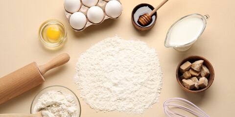 Different ingredients for baking on light background