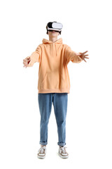 Fototapeta premium Teenage boy in VR glasses on white background