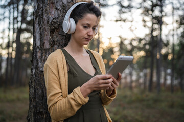 one woman in park or forest online guided meditation self-care concept