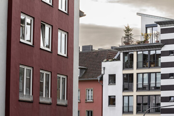 Typical residential street with contemporary multistorey residential buildings in a suburban street of Aachen, germany, being developed for real estate in a Western European background.