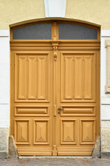 View of old building with wooden door