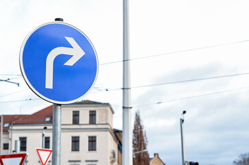 View of turn right sign in city, closeup - obrazy, fototapety, plakaty