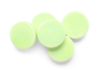 Green soluble tablets isolated on white background