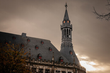 Selective blur and focus on the tower steeple of the Aachener Rathaus, the city hall of Aachen,...