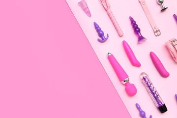 Different sex toys on pink background