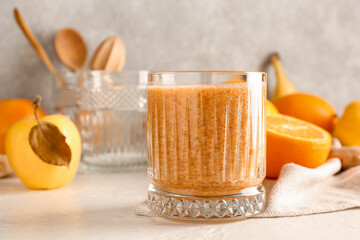 Glass of healthy fruit smoothie on table