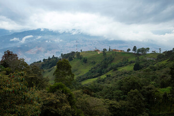Fototapeta na wymiar Antioquia mountainous landscape with mountains full of vegetation - San Felix, Bello - Colombia