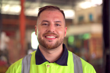 Happy caucasian white male factory worker or engineer portrait, a senior professional engineer or foreman portrait in factory.