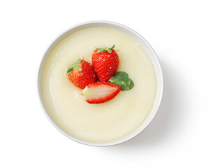 Bowl of tasty semolina porridge with strawberry on white background