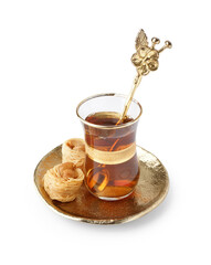 Glass cup of tea and Turkish delight on white background