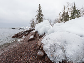 Snow covered beach of Lake Superior shoreline in the Tettegouche State Park, MN