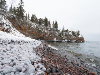 Ice coated pebbles along the shoreline of Lake Superior at the Tettegouche State Park, MN