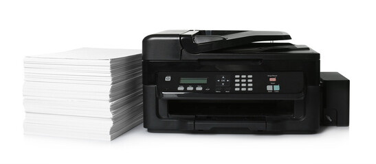 Modern printer and stack of paper on white background