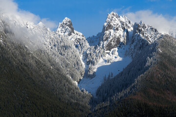 Snow covered Gunn Peak rising in the Wild Sky Wilderness of Western Washington