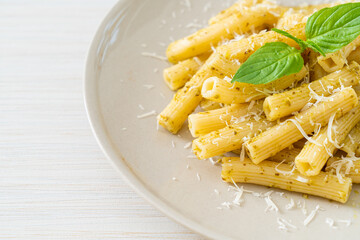 pesto rigatoni pasta with parmesan cheese