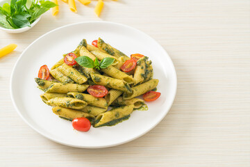 penne pasta with pesto sauce and tomatoes