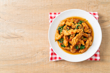stir-fried fried fish with basil and chili in thai style
