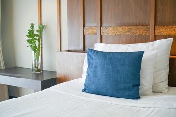 comfortable pillows and white pillows on bed