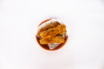 A bowl of fried bananas isolated on white background