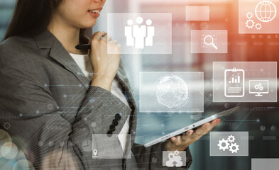 futuristic technology and online data storage for business network concept. businesswoman using tablet connects to internet server service presented in white digital graphic interface.