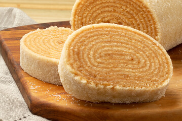 Focus on Brazilian roll cake of dulce de leche.