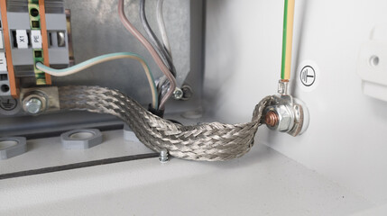 An electrical earthing line connection point of the electric panel body, green yellow ground wire.