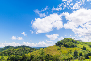 Fototapeta premium Panoramic view of clear blue sky and clouds, Blue sky background with tiny clouds. White fluffy clouds in the blue sky.