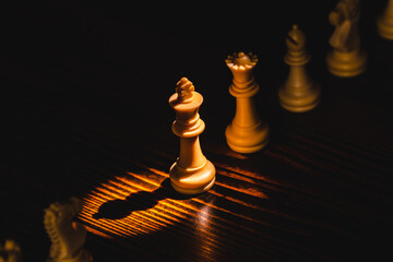 King chess pieces stand highlight leader with team concepts of challenge or business teamwork,...