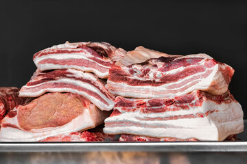 Fresh pork meat. Raw meat in the butcher shop. Sale of meat and semi-finished products. Pork.