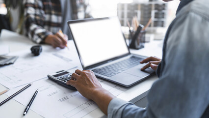 Image of engineer meeting for architectural project. working with laptop and engineering tools on workplace