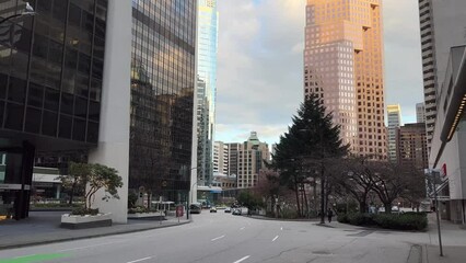 Vancouver Canada 2023 metropolis big city life skyscrapers tall new modern and old houses office Street in quite neighbourhood with beautiful trees - Powered by Adobe
