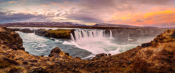 Panoramic view of Iceland Godafoss waterfall aka "Waterfall of the gods" with dramatic cloud during sunset