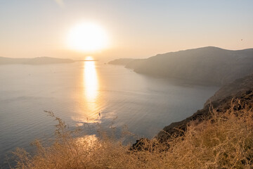Fototapeta na wymiar The magical sunset over the sea seen from santorini island 