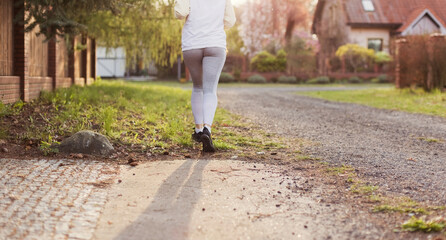 Fototapeta premium Running woman outdoors at sunlight