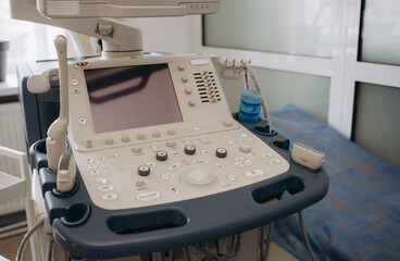 Interior of examination room with ultrasonography machine in hospital.
