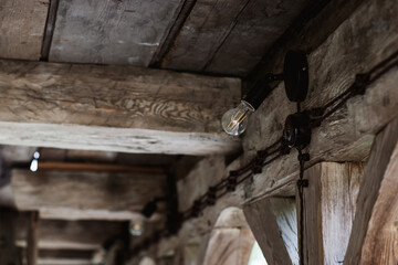  vintage lamp on wooden wall.