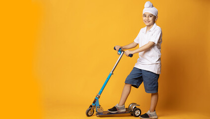 indian Sikh kids playing with scooter studio shoot © Photographielove