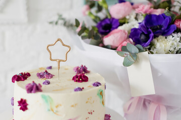 Fototapeta na wymiar Birthday cake with star sparklers candle