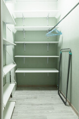 an empty dressing room is a place to store household items and clothes in the apartment