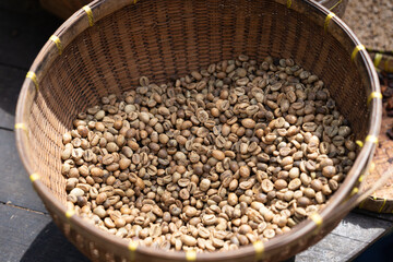 Unroasted coffee beans in a woven basket in Bali, Indonesia