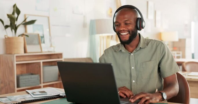 Laptop, headphones and black man on an online video call or meeting for his remote corporate job. Happy, talking and African guy on a webinar, video conference or seminar call with a computer at home