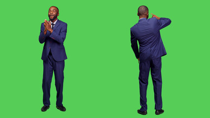 Cheerful startup worker applauding in studio, clapping hands and saying congratulations on camera. Young male entrepreneur doing standing ovation gesture, cheering for somebody.