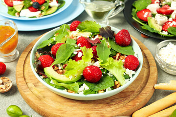 Concept of tasty food, salad with strawberry, close up