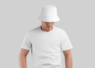 Mockup of a white panama on a cute guy in a t-shirt, isolated on the background.