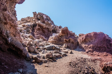 The red earth of the rocky coast of the red beach in santorini 