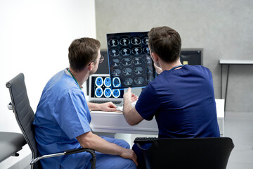 Doctors examining medical x-ray in hospital