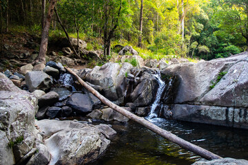 panorama of cedar creek swimming holes at sunset; a hidden stream with small pools near brisbane,...