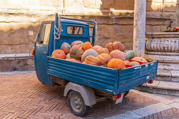 Van transporting heap of pumpkins